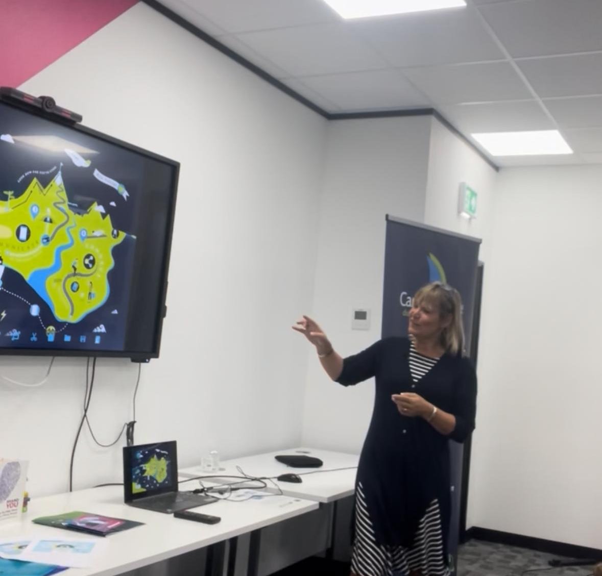 Sarah Taylor Phillips presenting to a room at a workshop.